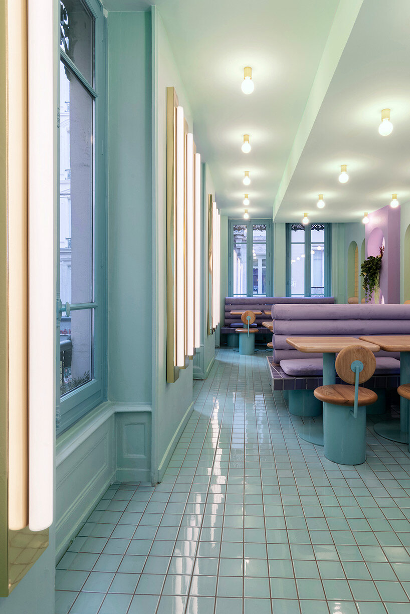 masquespacio infuses restaurant interior in france with pastel tones and lush greenery