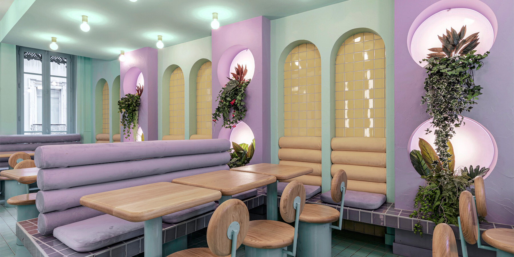 masquespacio infuses restaurant interior in france with pastel tones and lush greenery