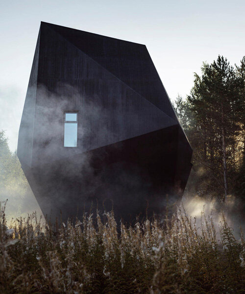 ateljé sotamaa's 'meteorite' residence emerges as a mystical dark object in finland