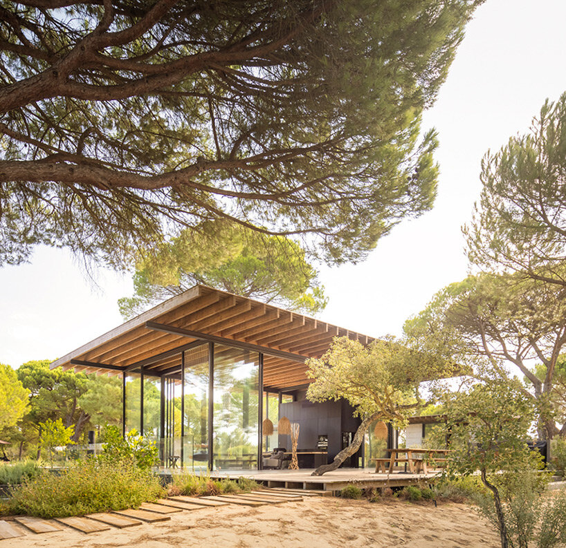 concrete platforms & wooden paths articulate residential extension by pereira miguel in portugal