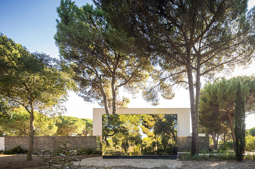 concrete platforms & wooden paths articulate residential extension by pereira miguel in portugal