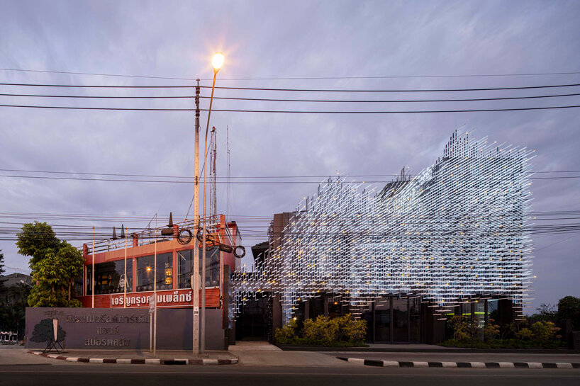 layered aluminum strips evoke dandelion seeds for this museum façade in bangkok