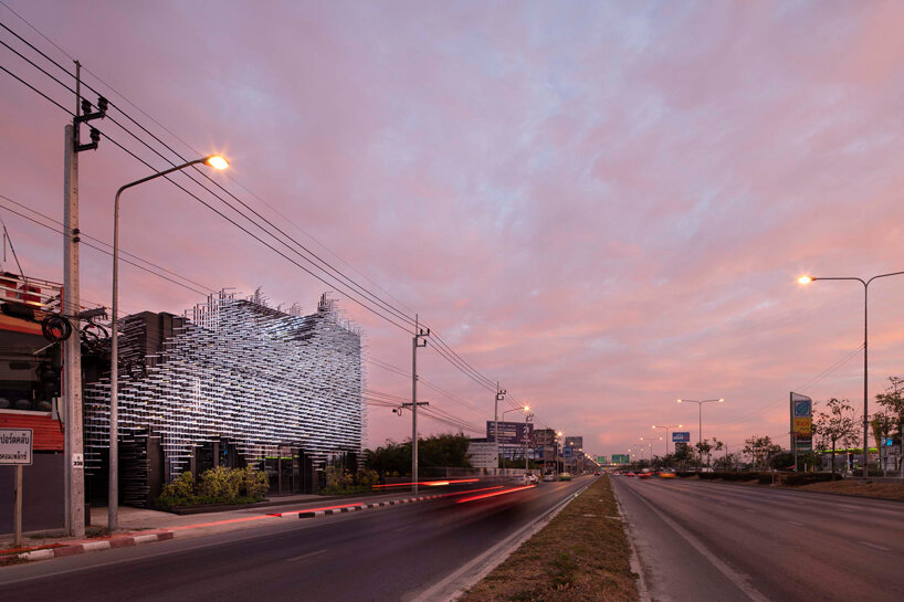 layered aluminum strips evoke dandelion seeds for this museum façade in bangkok