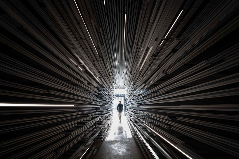 layered aluminum strips evoke dandelion seeds for this museum façade in bangkok