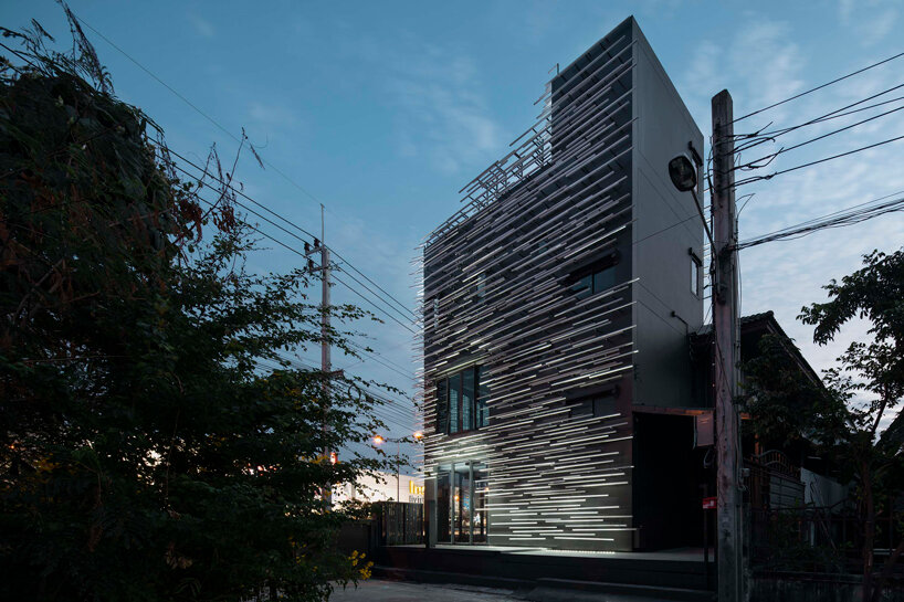 layered aluminum strips evoke dandelion seeds for this museum façade in bangkok