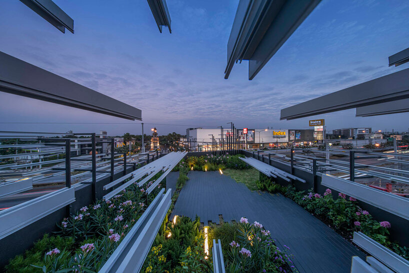 layered aluminum strips evoke dandelion seeds for this museum façade in bangkok