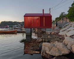 red-painted wooden cladding envelops tiny boathouse by handegård arkitektur in norway