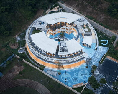 dika design envisions circular kindergarten in china as if 'eroded' by nature