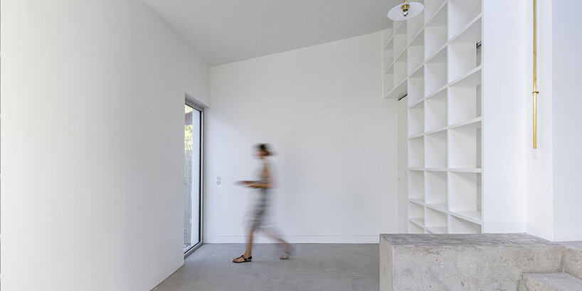 lines & curves engage in visual play within berenice curt's minimalist renovation in france