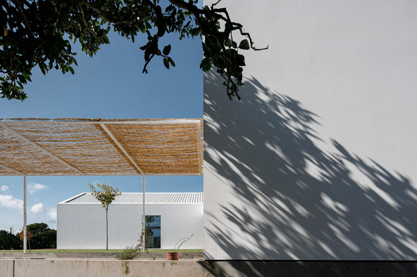NU.MA completes a minimalist house of gable roofs in santa joana, portugal
