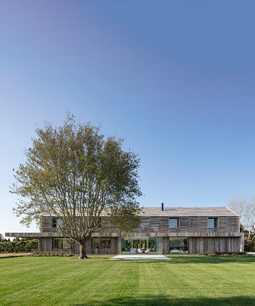 birdseye's lathhouse in the hamptons references traditional gabled farm structures