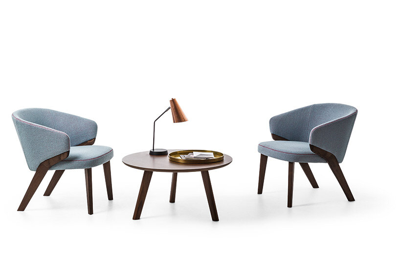 bross' expanded lounge system pairs woodwork with enveloping upholstery