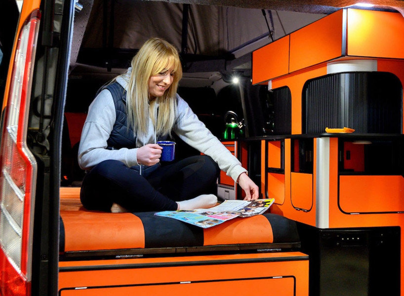 solar panels charge the new and spacious ford camper, making it fully electric