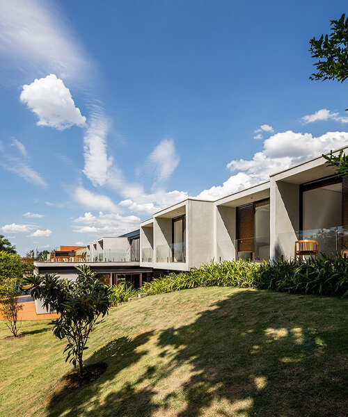 this 990 sqm house in são paulo is marked by two contrasting facades