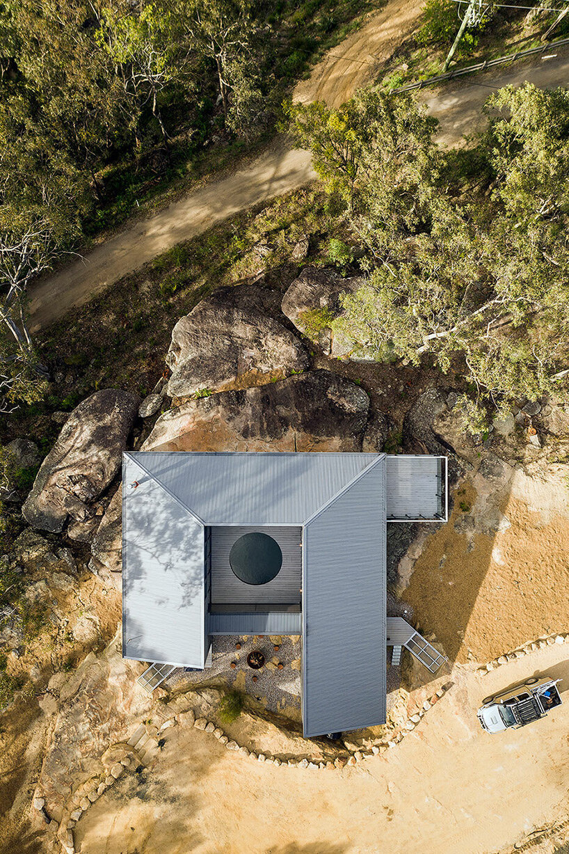 benn and penna architects wraps shipping container house around circular pool in australia