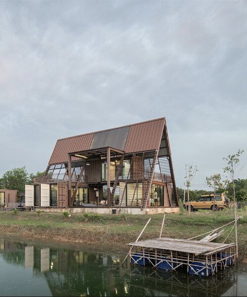 this cabin outside of bangkok holds container rooms under an A-frame roof