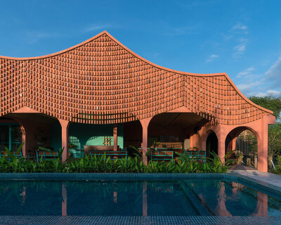 block architects drapes this duyen casa II hotel with a delicate brick 'curtain'