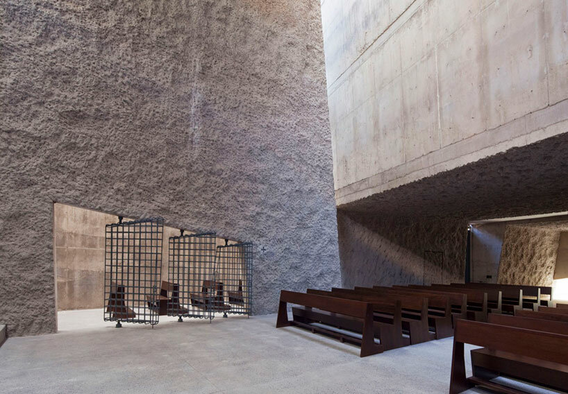 menis arquitectos' church on tenerife island is a cluster of monolithic stone blocks