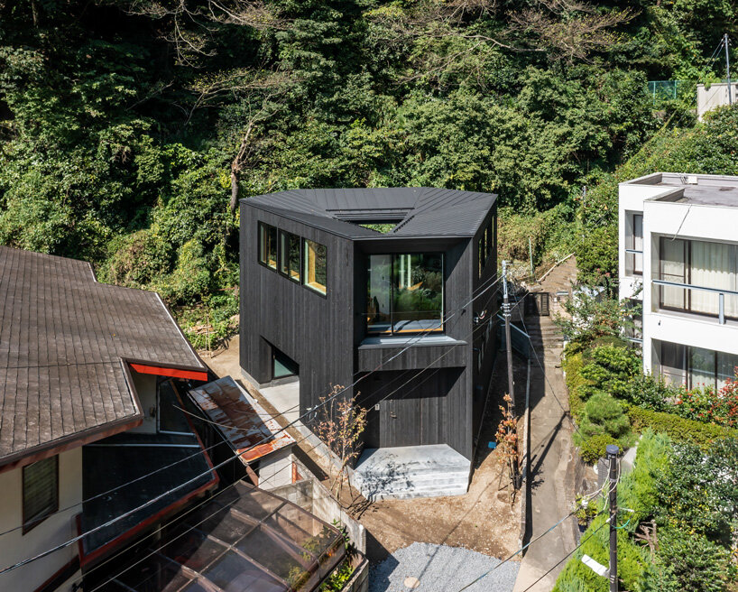 FUDO architects tops yamanone no ie house in japan with origami-like metal roof
