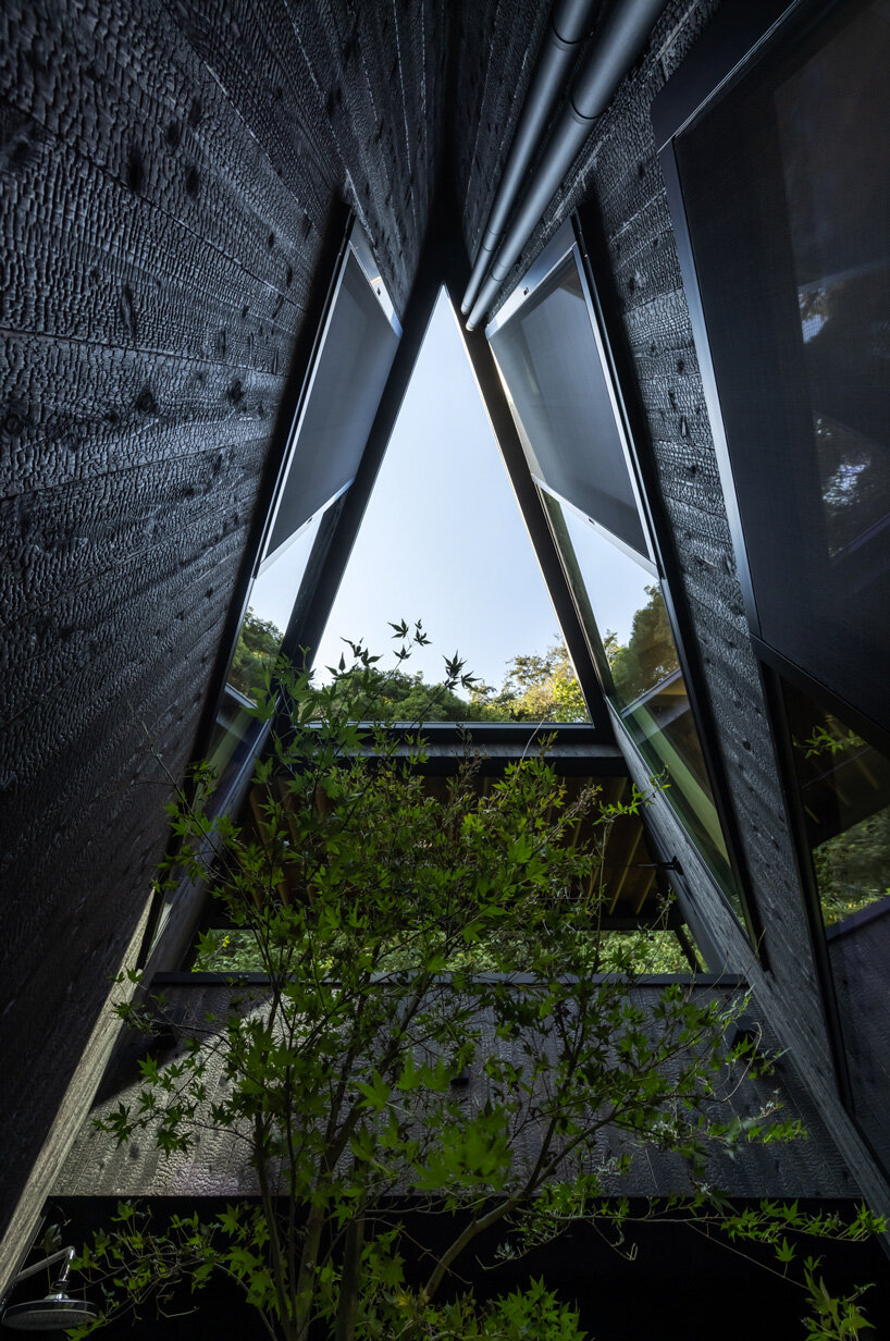FUDO architects tops yamanone no ie house in japan with origami-like metal roof