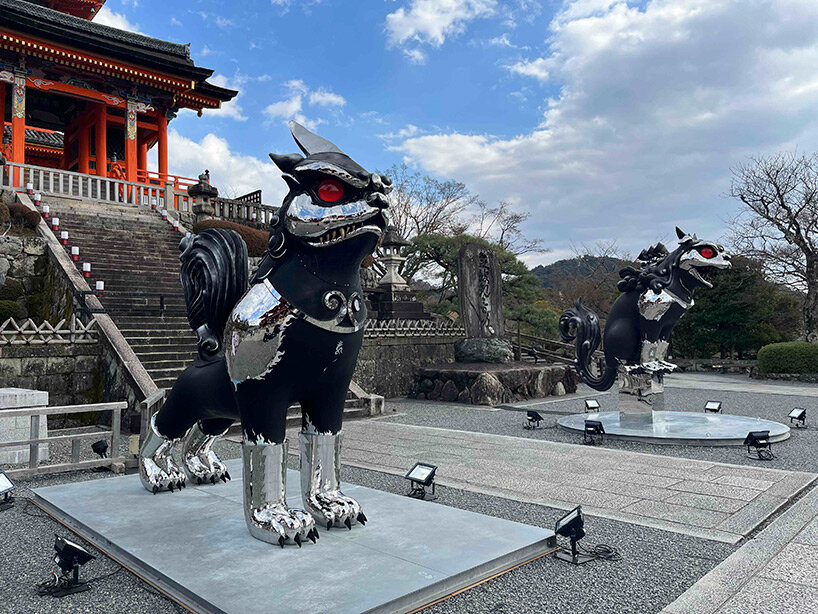 giant kokeshi doll welcomes visitors to historic kiyomizu-dera temple in kyoto