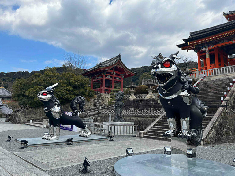 giant kokeshi doll visitors to historic kiyomizudera temple