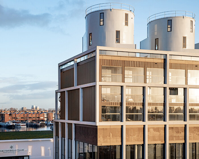 three converted wine silos top amsterdam’s new 'harbour club' by LEVS architecten