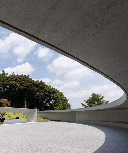 KINO architects completes japanese cemetery with arc-shaped plaza for contemplation