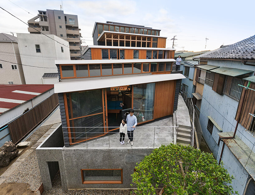 seven staggered volumes by KOMPAS accommodate a family house and gallery in japan