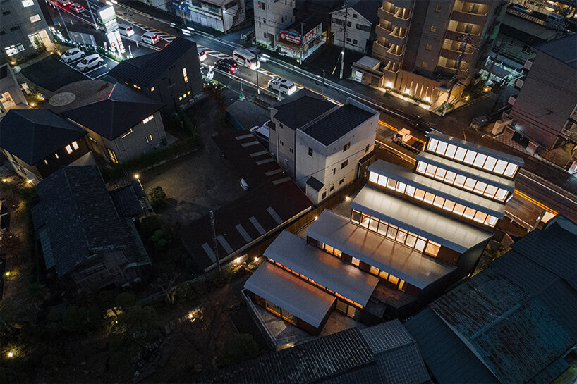 seven staggered volumes by KOMPAS accommodate a family house and gallery in japan