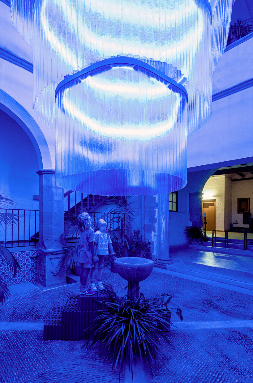 monumental lamp installation lights up the main patio of a 17th century monastery in spain bouzas. del aguila