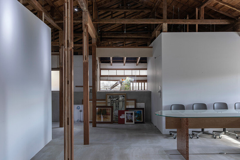 old japanese house half-buried in mortar mass emerges in renovation by naoshi kondo