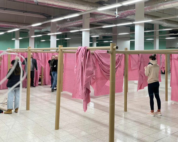 shigeru ban and VAN install paper partition shelters for ukrainian refugees in europe