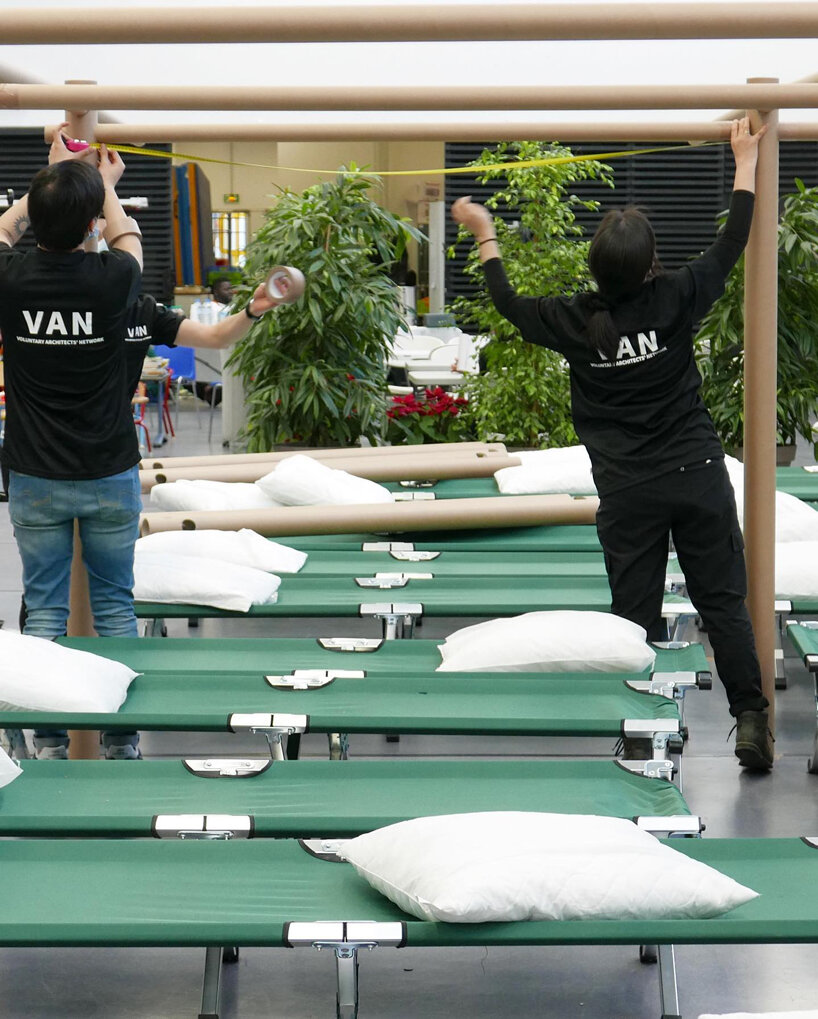 shigeru ban and VAN install paper partition shelters for ukrainian refugees in europe