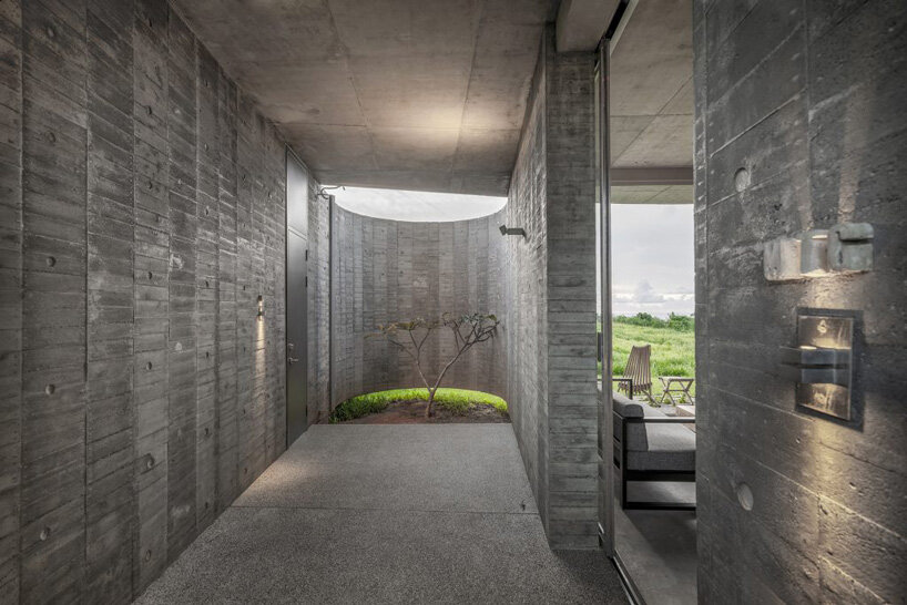 curvaceous concrete walls compose XRANGE architects' remote retreat in taiwan