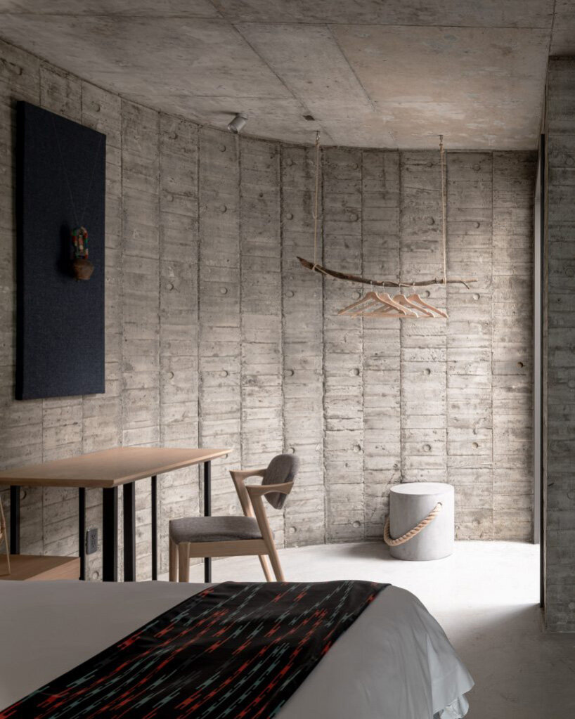 curvaceous concrete walls compose XRANGE architects' remote retreat in taiwan