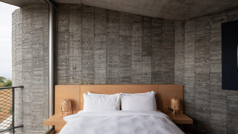 curvaceous concrete walls compose XRANGE architects' remote retreat in taiwan