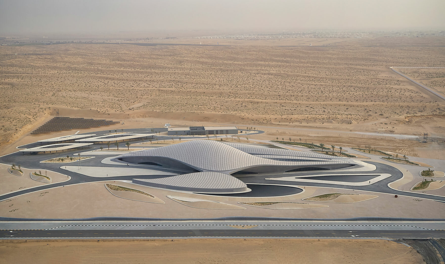 zaha hadid architects' BEEAH headquarters mimics the desert dunes