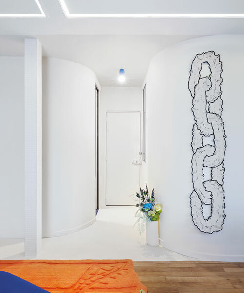 zyva studio's 'straight curves' apartment brings vibrant digital motifs to paris