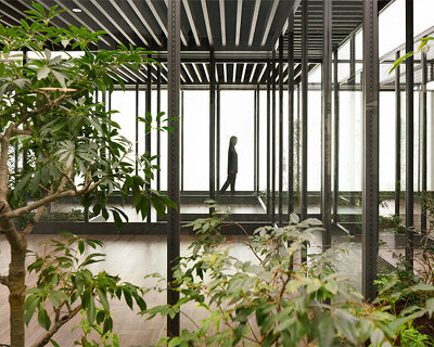 nendo designs plant-filled communication lounge for japanese homebuilder company in osaka