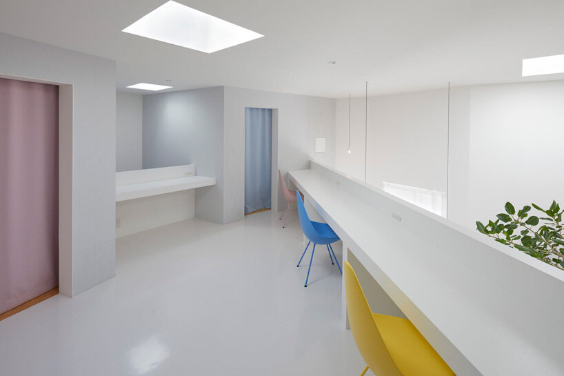 japanese residence by airhouse encloses minimalist interior of slanted ...