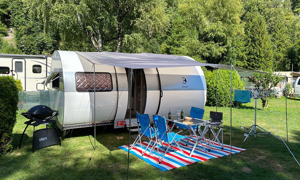 the beauer 3XC camper is a tiny can-shaped trailer that expands to triple its size