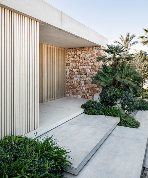 BEEF architekti reinterprets mallorca's traditional stone walls with its 'casa fly'