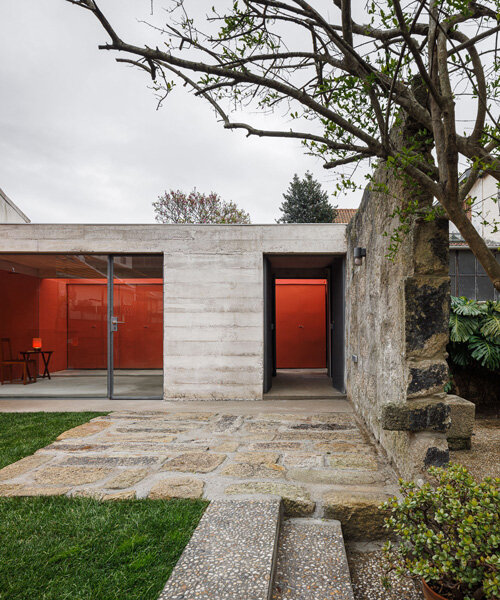 white concrete encloses josé pedro lima's bright red multi-use garden pavilion in portugal