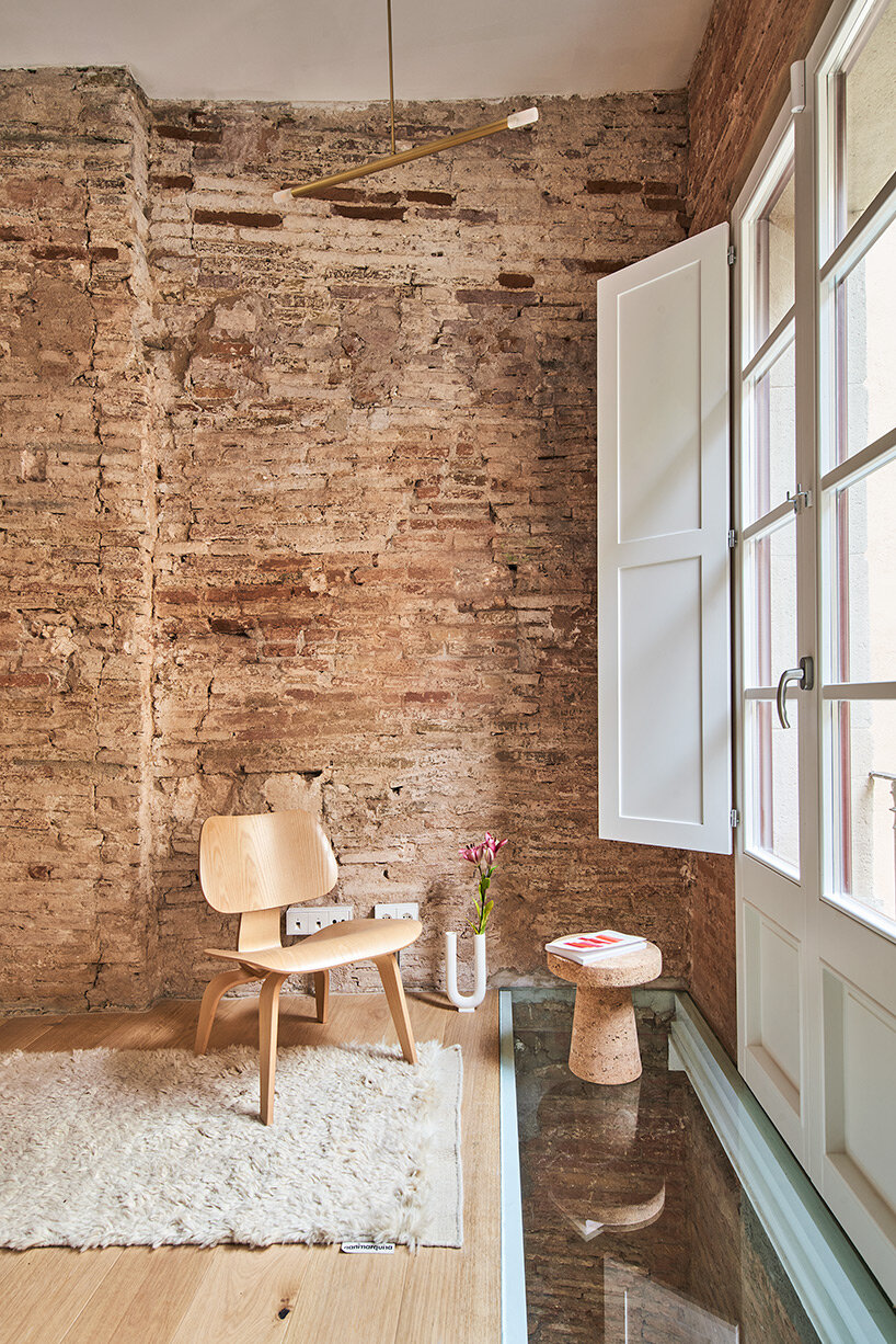 raúl sánchez installs brass kitchen to brick residential interior in  barcelona