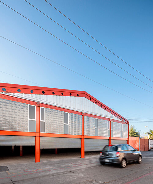 bright orange coating outlines this steel warehouse in morelia, mexico