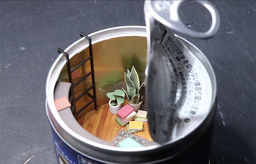 empty food can becomes portal to cozy, miniature reading room