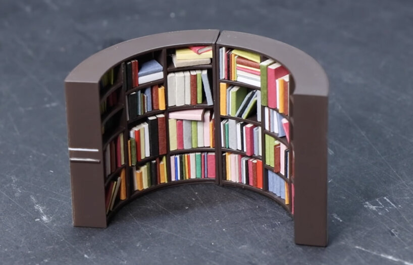 the empty tin can becomes the portal to a cozy, miniature reading room