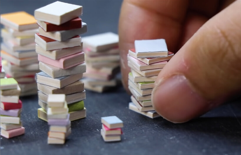 empty food can becomes portal to cozy, miniature reading room