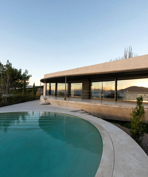 tense architecture network adds circular pool to concrete island residence in greece